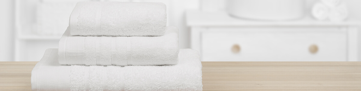 3 stacked white towels